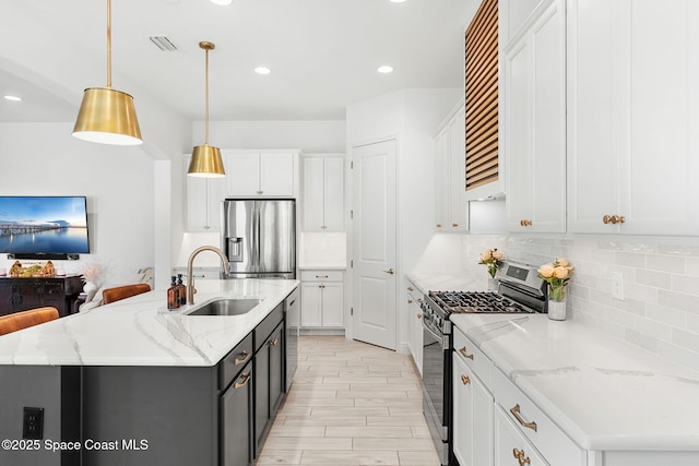 8048 Gullen Dr, Melbourne, FL 32940 - kitchen featuring backsplash, stainless steel appliances, white cabinetry, and a sink