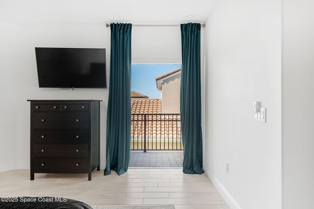8048 Gullen Dr, Melbourne, FL 32940 - bedroom with wood tiled floor and baseboards