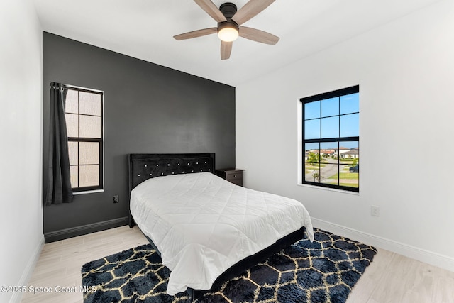 8048 Gullen Dr, Melbourne, FL 32940 - bedroom featuring baseboards, ceiling fan, and wood finished floors