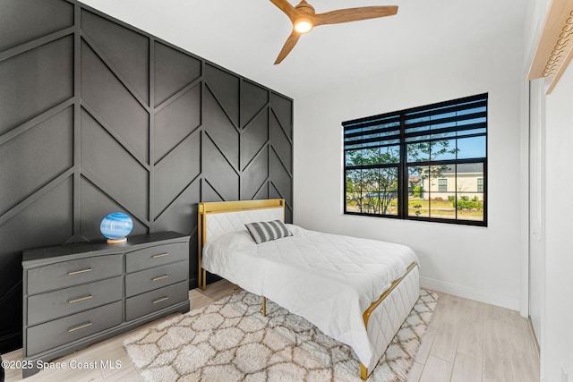 8048 Gullen Dr, Melbourne, FL 32940 - bedroom with baseboards, ceiling fan, and light wood finished floors
