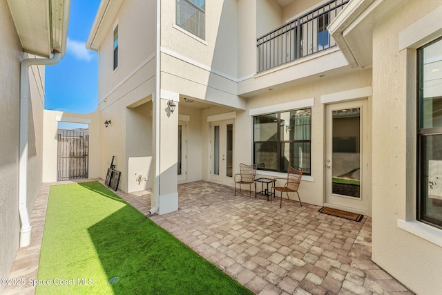 8048 Gullen Dr, Melbourne, FL 32940 - rear view of property with fence, french doors, a patio area, and stucco siding