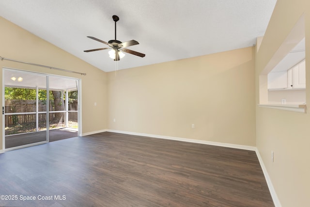 spare room featuring dark wood-style floors, baseboards, and ceiling fan