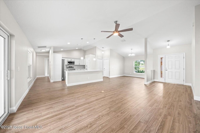 1204 Captiva Island Cir SW, Palm Bay, FL 32908 - unfurnished living room with vaulted ceiling, a ceiling fan, light wood-style flooring, baseboards, and recessed lighting