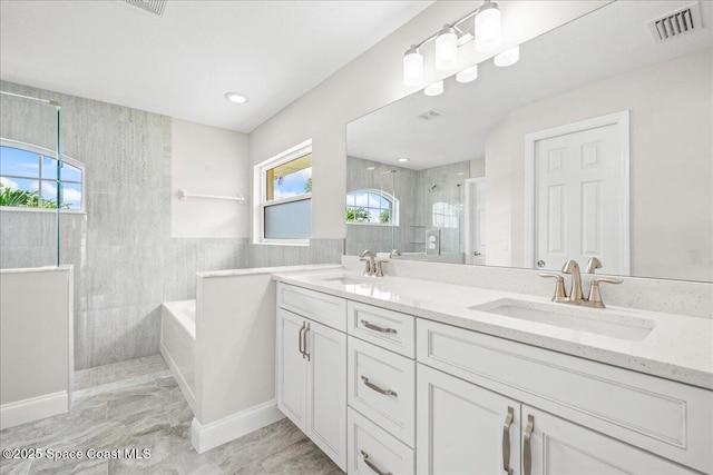 1204 Captiva Island Cir SW, Palm Bay, FL 32908 - bathroom featuring a tile shower, a bath, and double vanity