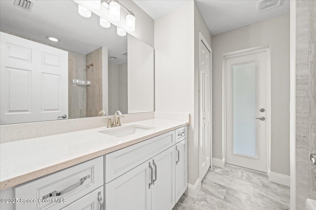 1204 Captiva Island Cir SW, Palm Bay, FL 32908 - bathroom with vanity, baseboards, tiled shower, and marble finish floors