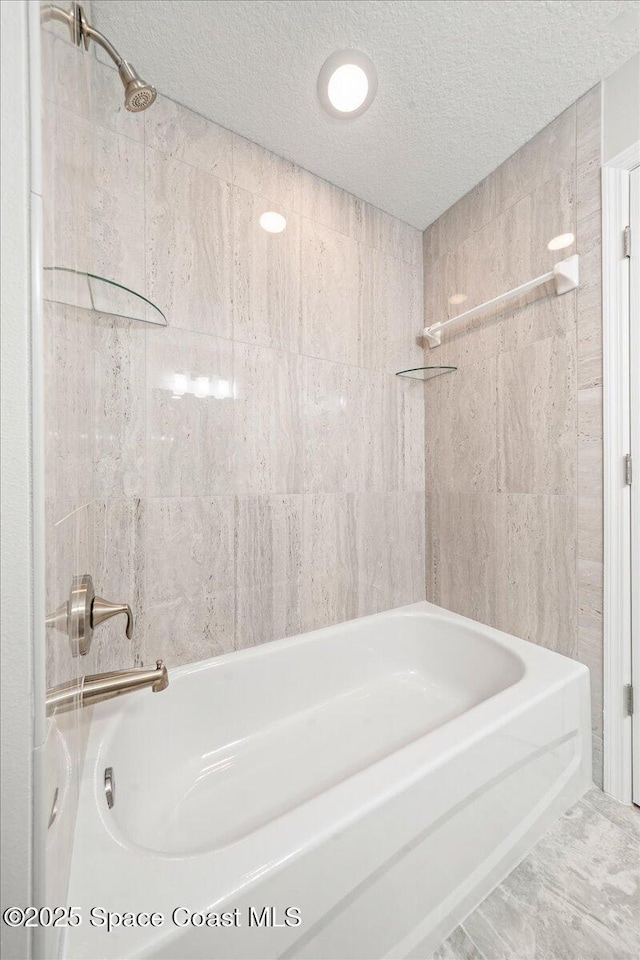 1204 Captiva Island Cir SW, Palm Bay, FL 32908 - full bath featuring  shower combination and a textured ceiling