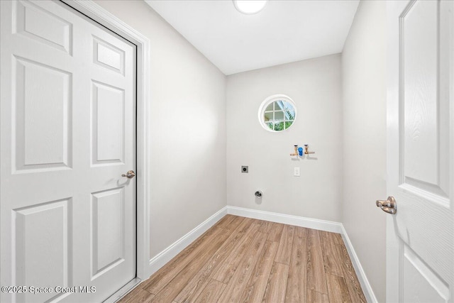 1204 Captiva Island Cir SW, Palm Bay, FL 32908 - laundry area featuring hookup for an electric dryer, light wood-style flooring, hookup for a washing machine, and baseboards