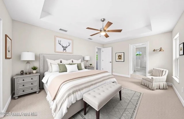 1204 Captiva Island Cir SW, Palm Bay, FL 32908 - bedroom with light carpet, baseboards, a ceiling fan, and ensuite bathroom