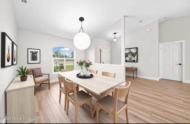 1204 Captiva Island Cir SW, Palm Bay, FL 32908 - dining room featuring light wood-type flooring, lofted ceiling, and baseboards