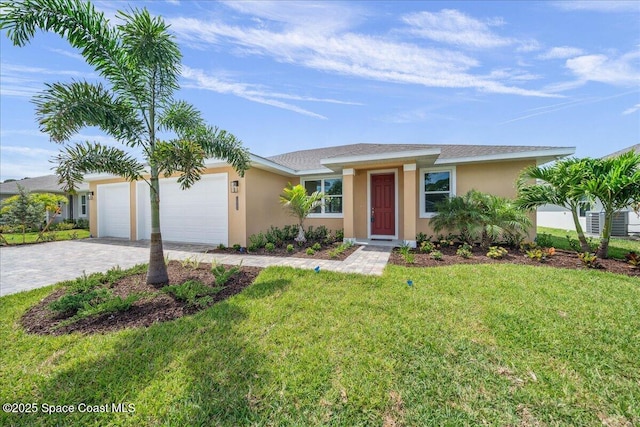 1035 Captiva Island Cir SW, Palm Bay, FL 32908 - ranch-style house featuring stucco siding, a garage, decorative driveway, and a front yard