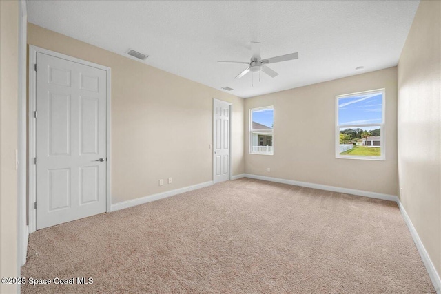 1035 Captiva Island Cir SW, Palm Bay, FL 32908 - unfurnished bedroom featuring carpet flooring, baseboards, and ceiling fan