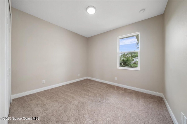 1035 Captiva Island Cir SW, Palm Bay, FL 32908 - carpeted empty room with baseboards and a smoke detector