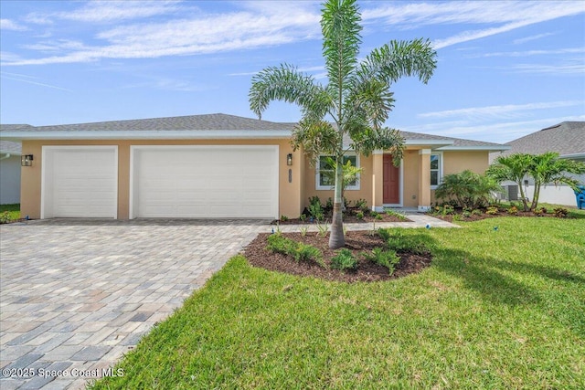 1035 Captiva Island Cir SW, Palm Bay, FL 32908 - ranch-style home with stucco siding, a garage, decorative driveway, and a front lawn