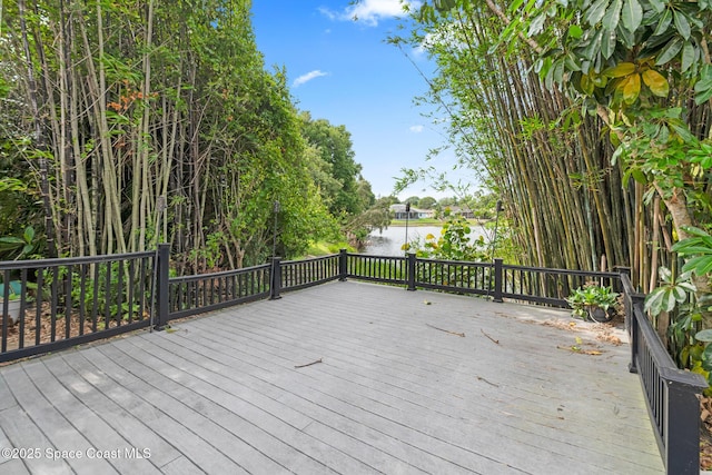wooden terrace with a water view