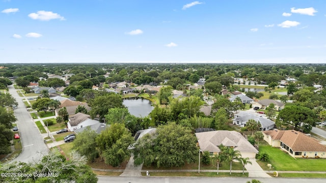aerial view of residential area with a large body of water