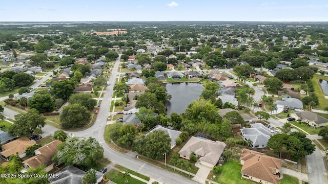 aerial overview of property's location featuring nearby suburban area and a large body of water