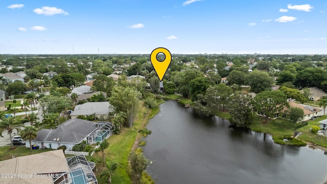 aerial view of property and surrounding area featuring a nearby body of water and nearby suburban area