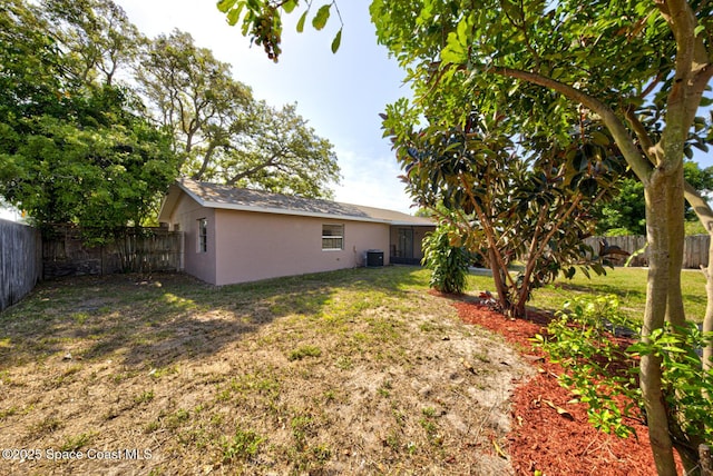 view of yard featuring a fenced backyard and cooling unit
