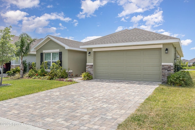 ranch-style house with decorative driveway, a front lawn, stone siding, and stucco siding