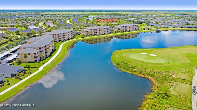 bird's eye view with golf course view, a residential view, and a water view