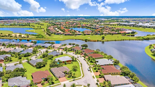 aerial view featuring a residential view, a water view, and golf course view