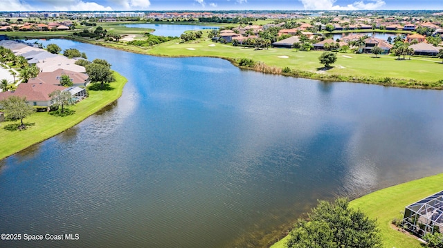 birds eye view of property featuring a water view, a residential view, and view of golf course