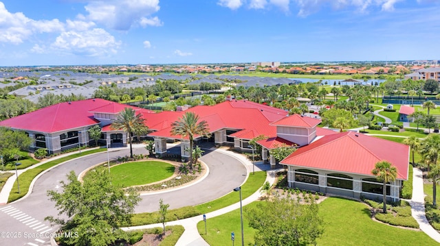 birds eye view of property featuring a residential view and a water view