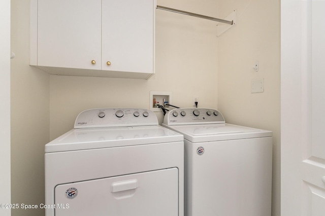 laundry area with cabinet space and washer and clothes dryer