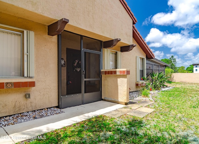 836 Brow Ct NE, Palm Bay, FL 32905 - property entrance with stucco siding
