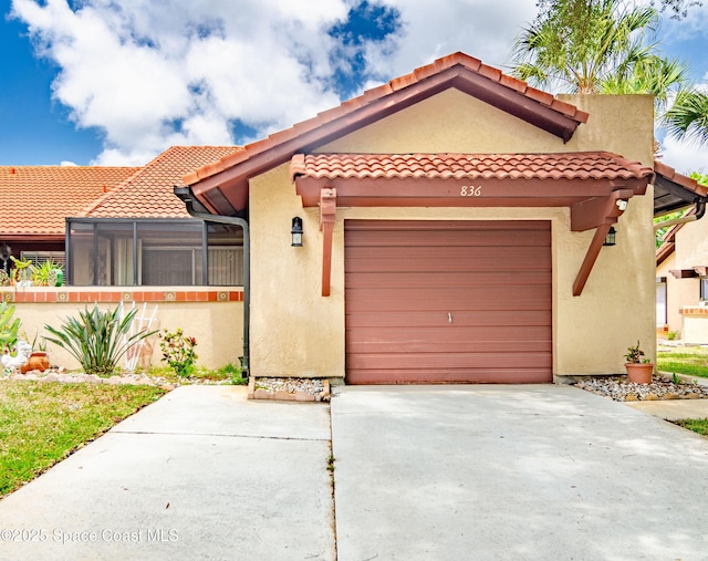 836 Brow Ct NE, Palm Bay, FL 32905 - view of front of home with a tile roof, driveway, a garage, and stucco siding