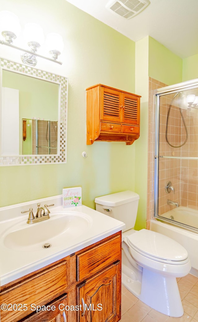 836 Brow Ct NE, Palm Bay, FL 32905 - full bathroom featuring toilet, tile patterned flooring, visible vents, and vanity