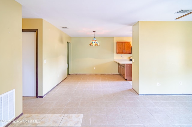 836 Brow Ct NE, Palm Bay, FL 32905 - empty room with baseboards, visible vents, and light tile patterned floors