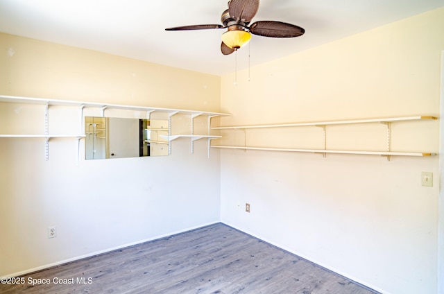 836 Brow Ct NE, Palm Bay, FL 32905 - spare room with ceiling fan, wood finished floors, and baseboards