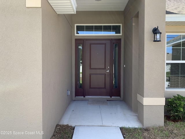 1822 San Filippo Dr SE, Palm Bay, FL 32909 - view of exterior entry featuring stucco siding