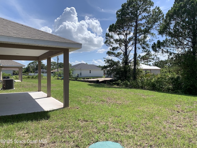 1822 San Filippo Dr SE, Palm Bay, FL 32909 - view of grassy yard featuring a patio