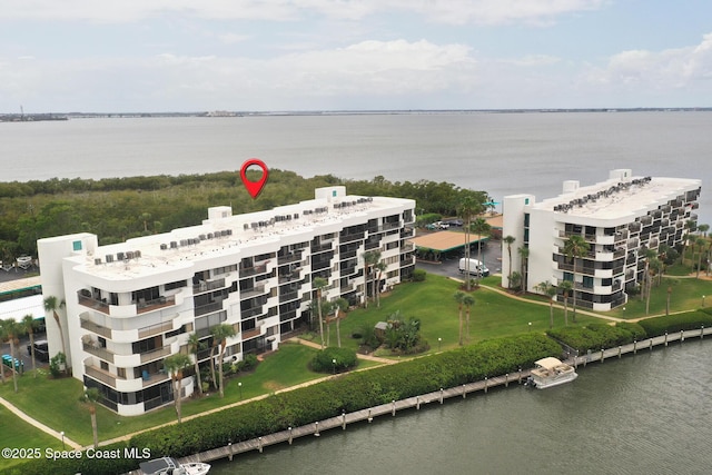 300 Columbia Dr Unit 203-2, Cape Canaveral, FL 32920 - drone / aerial view of apartment complex and a large body of water