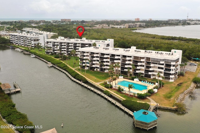 300 Columbia Dr Unit 203-2, Cape Canaveral, FL 32920 - drone / aerial view of a large body of water, apartment complex, and a pool
