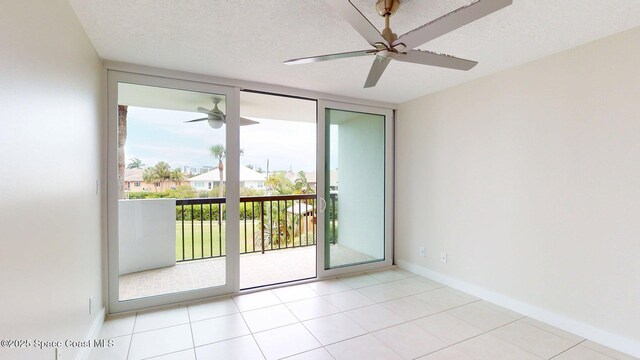 300 Columbia Dr Unit 203-2, Cape Canaveral, FL 32920 - empty room with a ceiling fan, baseboards, and a wall of windows