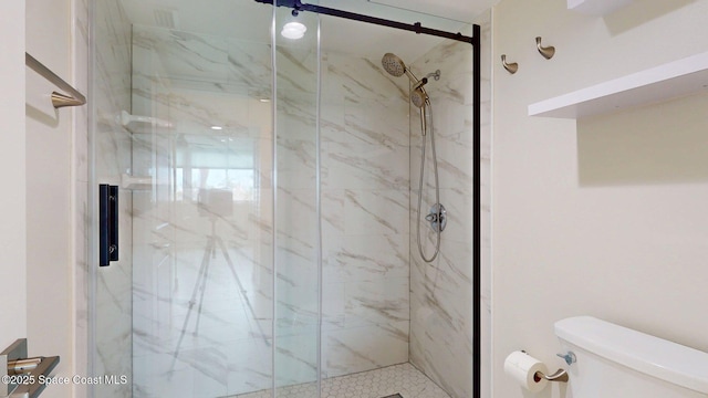 300 Columbia Dr Unit 203-2, Cape Canaveral, FL 32920 - bathroom featuring toilet and a marble finish shower