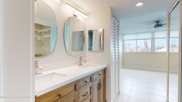 300 Columbia Dr Unit 203-2, Cape Canaveral, FL 32920 - bathroom featuring ceiling fan, tile patterned flooring, a closet, double vanity, and recessed lighting