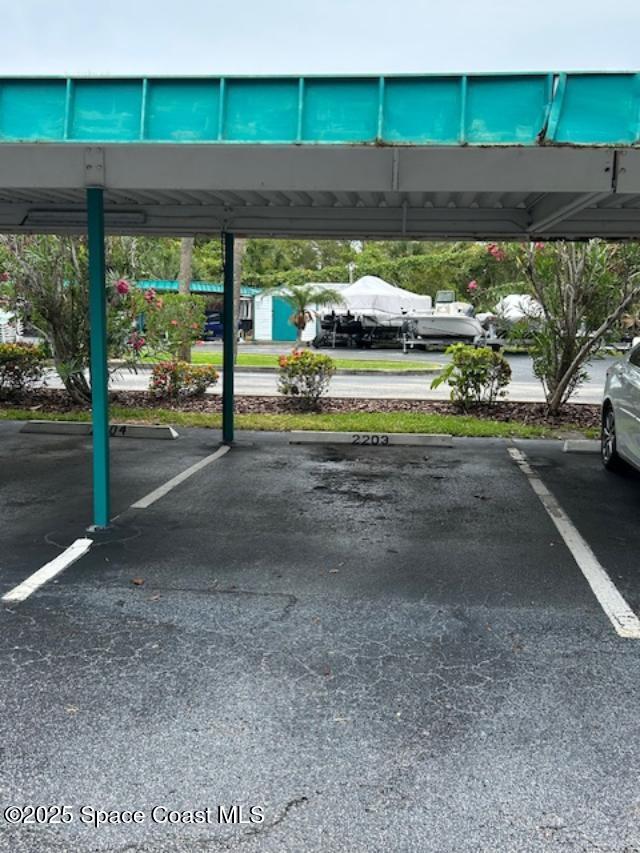 300 Columbia Dr Unit 203-2, Cape Canaveral, FL 32920 - view of covered parking lot