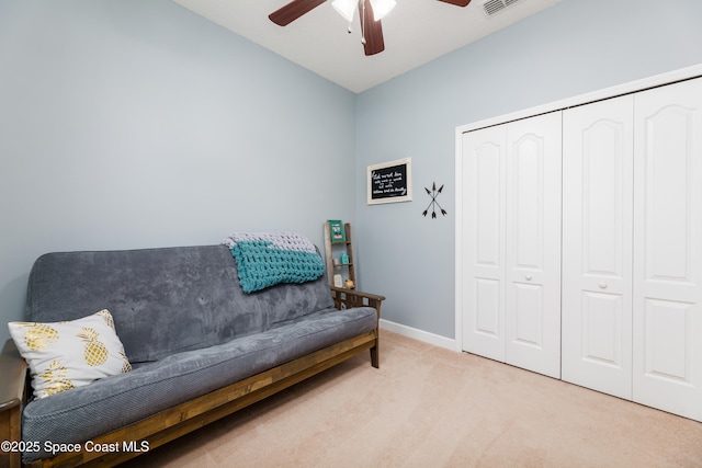 sitting room featuring carpet flooring, ceiling fan, visible vents, and baseboards