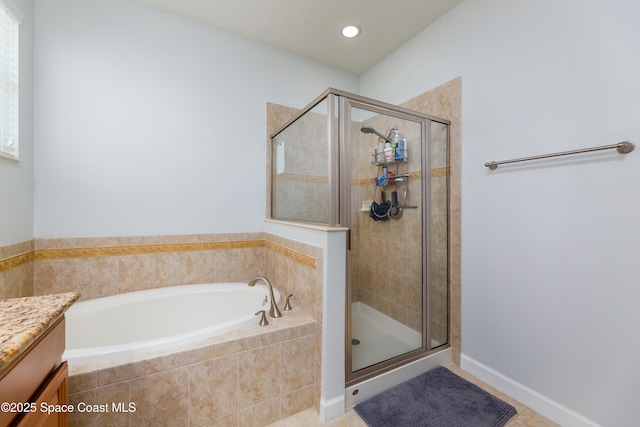 full bathroom with tile patterned flooring, a shower stall, a bath, and vanity