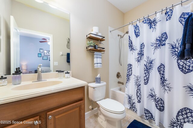 full bathroom featuring tile patterned floors, shower / bathtub combination with curtain, vanity, and toilet