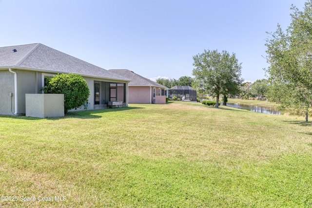 view of yard with a water view