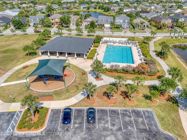 birds eye view of property with a water view