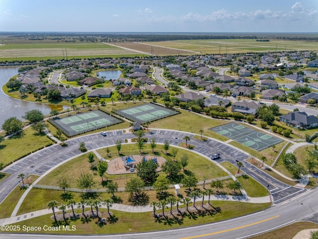 aerial view with a residential view and a water view