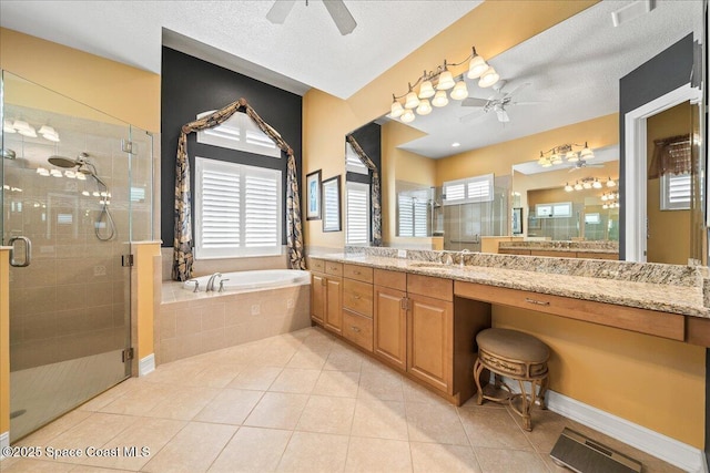 bathroom with tile patterned floors, a shower stall, a ceiling fan, and a garden tub