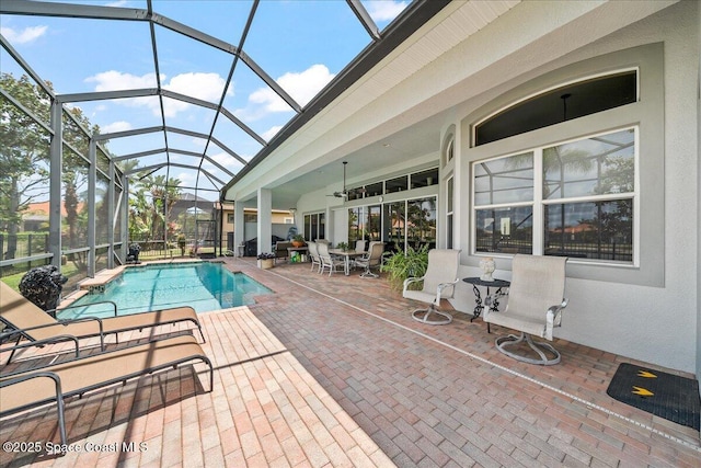 pool featuring a ceiling fan, a patio area, and a lanai