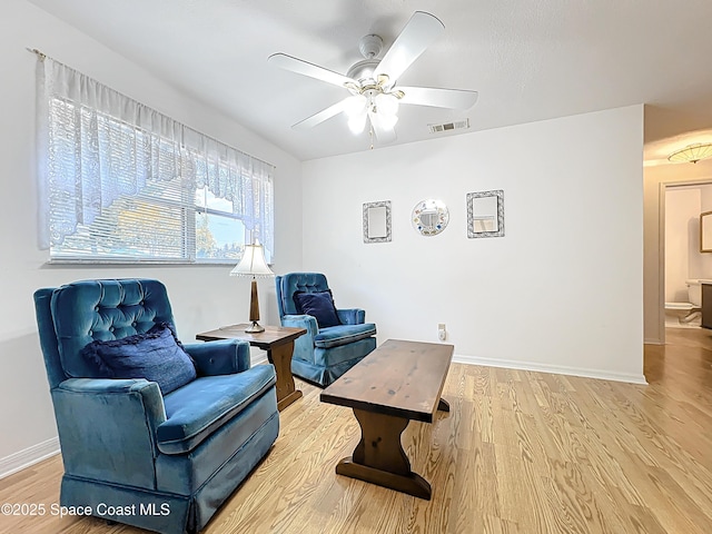537 Ebony St, Melbourne, FL 32935 - sitting room with baseboards, light wood-type flooring, and a ceiling fan